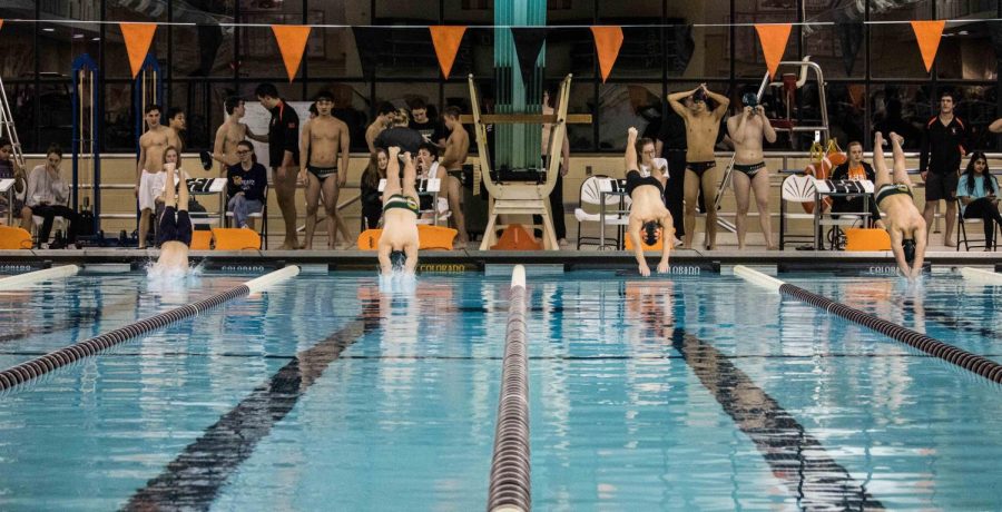 JV 1 launches into the pool in the 100 butterfly event. 