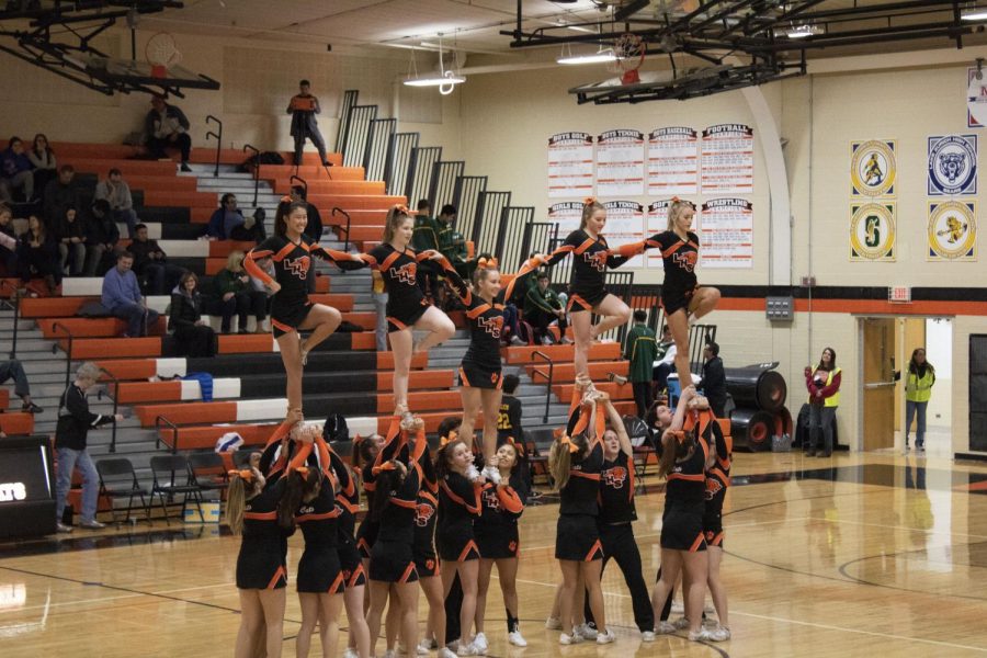 The LHS cheerleaders perform a brief routine at halftime for the crowd.