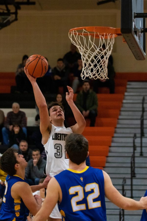 Uncontested, Clark rises up for a layup to try to give the Cats the edge as the clock ticks down.