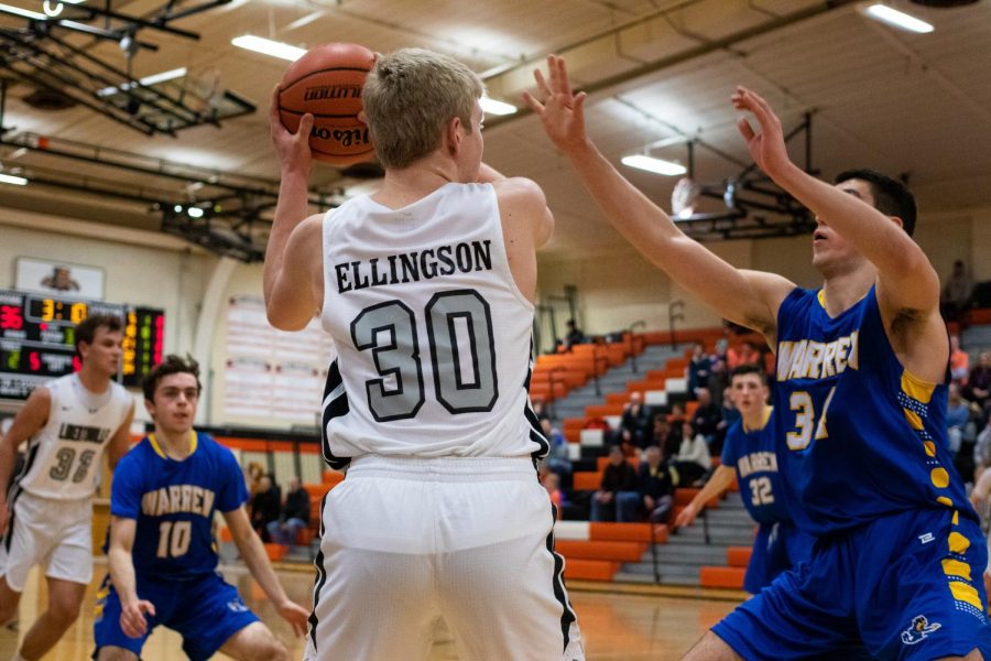 Recently back from a serious leg injury suffered during football season, sophomore Blake Ellingson, who started this game, looks to make a difference in the third quarter.