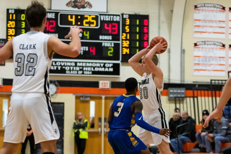 Ellingson keeps the ball away from his defender as the final minutes of the game approach.