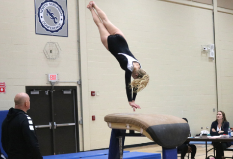 Senior Kylie Skie lands her second jump off the vault.