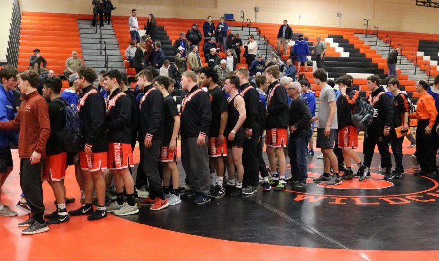 Both teams shake hands after the meet ended with a score of 47-15 in Libertyville’s favor.