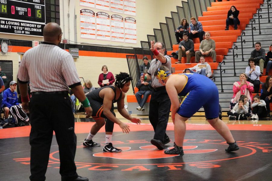 Junior Jordan Smith squares off against his opponent at the start of his match.