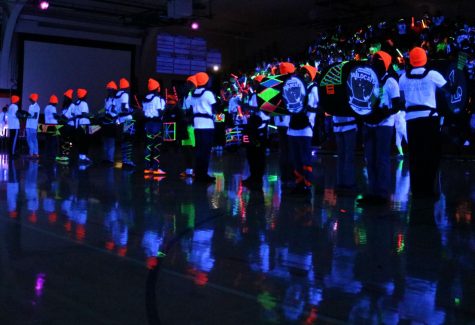 A neon-decked drumline performed to rally the students after the cheer team’s routine.
