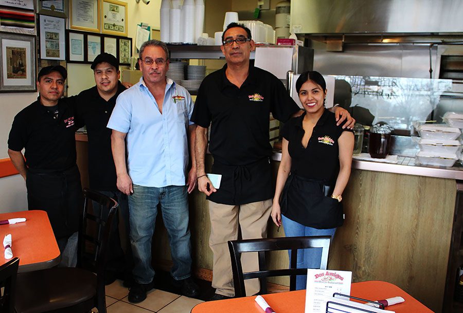 Sergio Casillas (center), co-owner of Dos Amigos, places a large emphasis on his staff interacting well with customers and representing the business in a positive way. One of the unique aspects of his business is the open kitchen, where customers are able to see, smell and hear what is happening.