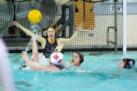 The Cats’ successful offense in the first quarter started with Katie DeAcetis’ communication and defense in goal, who watches on as her defenders swarm the ball.