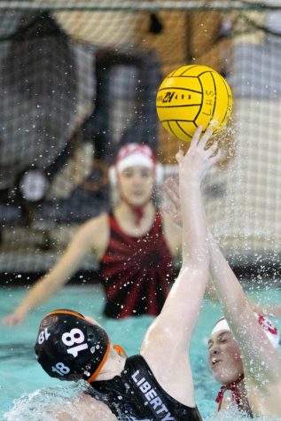 From far range, Julia Fryrear launches the ball over a Deerfield defender.