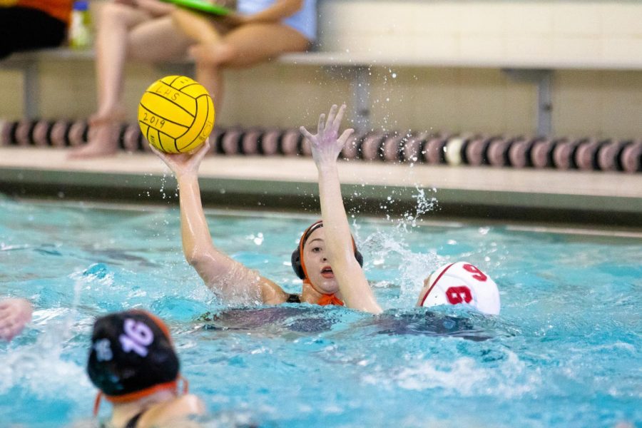 Looking to pass the ball in front of the goal, Anna Heard (11) spots her teammate Kate Speer (16).