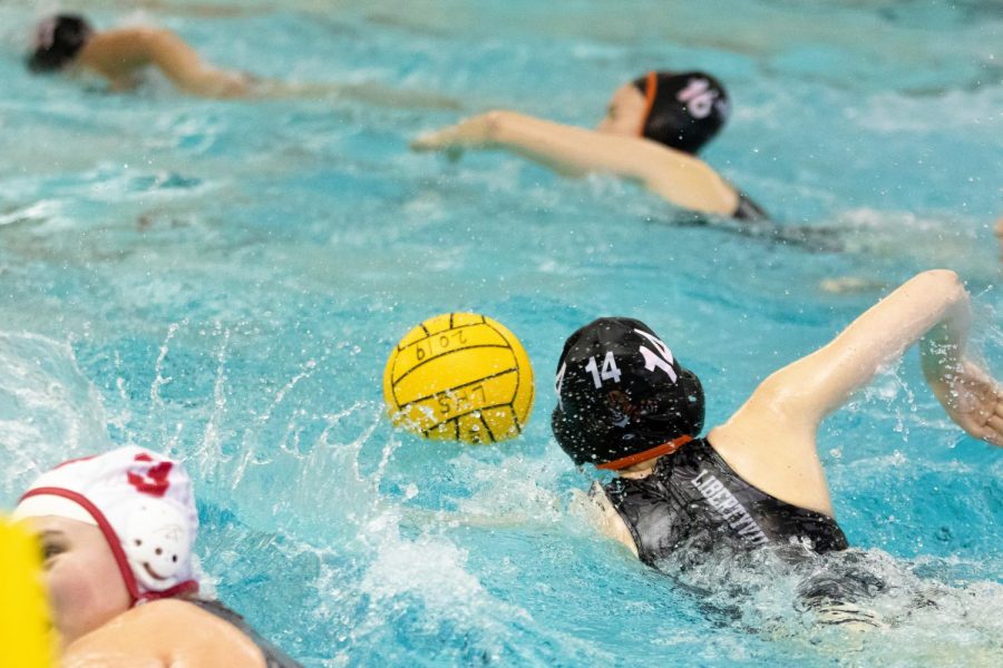 Rankin swims with the ball during the fourth quarter, looking to add to the Wildcats’ healthy lead.
