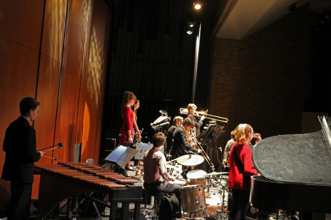 The Jazz Ensemble performed six different, unique pieces. Standing toward the middle of the photo is junior Jake Short soloing on the bass trombone.