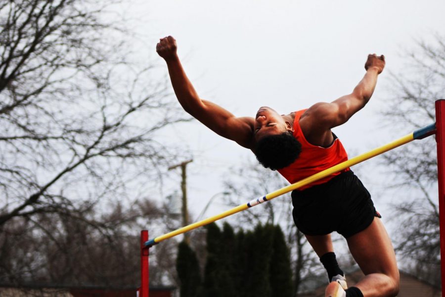 Sophomore Jalen Pitts attempts to clear his personal high jump record at a track meet.