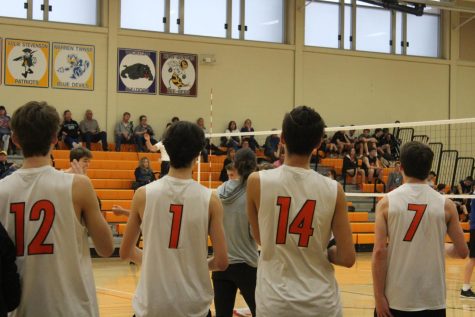 Phillip Loveland (11), Ness (1), Charlie Schmidtt (14) and Matt Apgar (7) support their teammates from the bench.