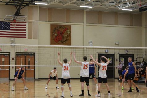 Chris Mack, Brendan Duffy, and Weick get set as their teammate prepares to serve.