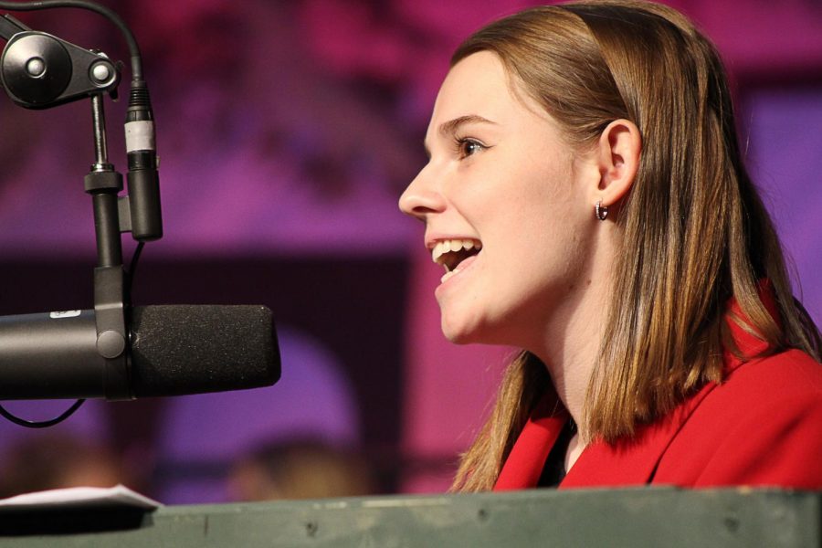 Wrigley Field Announcer Kelsey Collins reports who is up to bat during each inning. 