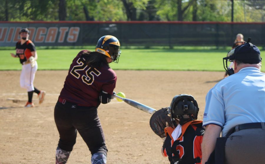 Senior pitcher Amanda Page pitches the ball to Zion’s first baseman, Jenna Villalobos, who got a hit in this at bat.