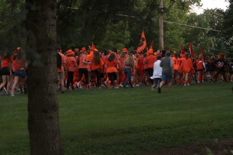 Students enter the North Shore bike path, following the cheerleaders and marching band.