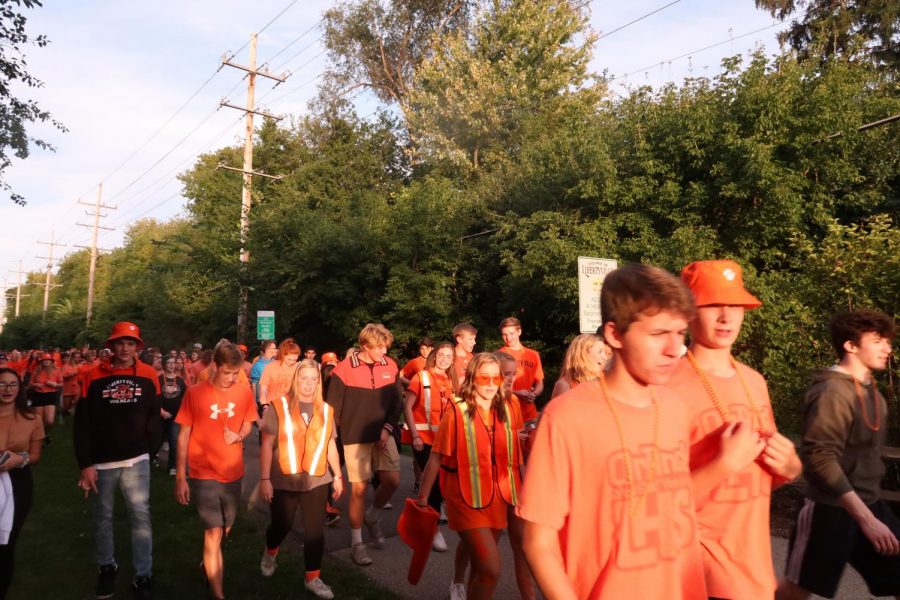 Many students wore the orange shirts and bucket hats they purchased from spirit pack sales.