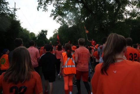 Students display their school pride in a variety of ways, ranging from wearing orange beanies and leggings to painting their faces and legs.