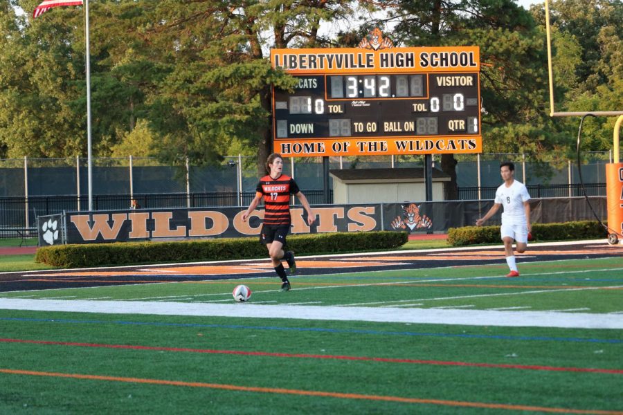 Senior Patrick Graham looks forward to pass the ball upfield. 