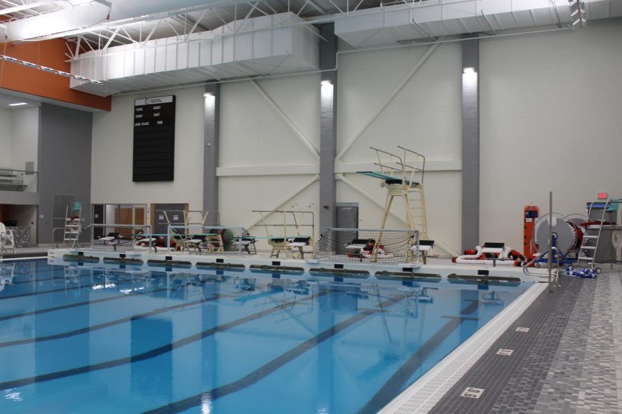 With the diving boards in a separate section of the pool as the main lanes, more events can be run simultaneously at swim meets when the divider is put in the middle of the pool.