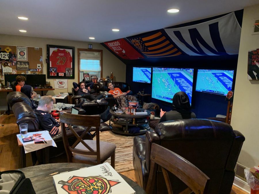 Senior Jarod Rosenbloom’s fantasy football league gathers around to watch the games and track their players. The focal point of their room consists of three TVs: one in the center to play their main game and the other surrounding two to watch NFL Red Zone.