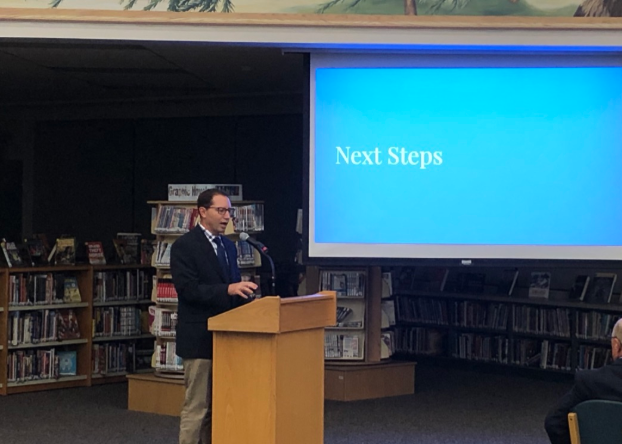 LHS Principal Tom Koulentes presents the next steps for the D128 DARING mission to the Board of Education during its September meeting.