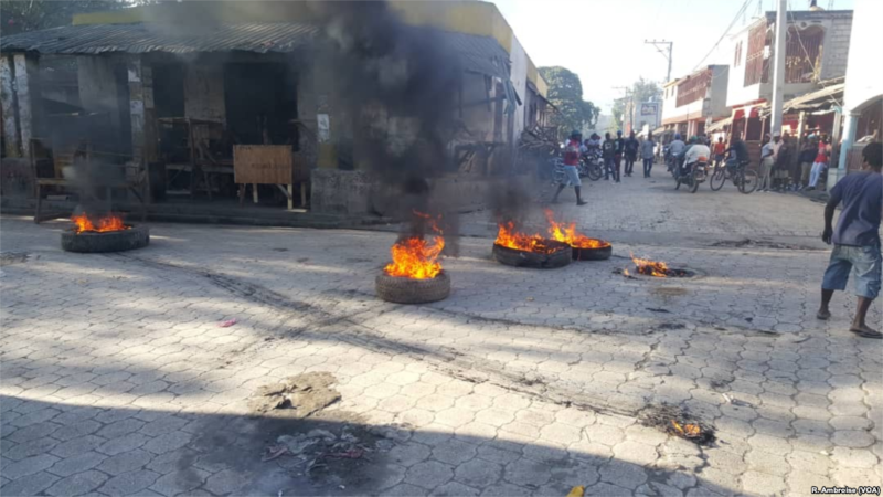 Tires have been set on fire in the streets of Hince, Haiti, in early February.