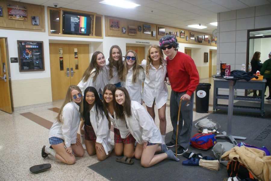 Every Halloween, the senior girls dress up as Tom Cruise’s character from the movie “Risky Business.” Senior girls (top row, left to right) Mia Michaels, Abigail Parkerson, Cate Dudley and Maeve Rattin, plus (bottom row, left to right) Ellie Dapier, Erin Custod, Maria Kavathas and Cameron Hamilton dressed up in their Tom Cruise costumes while Joe Mattson dressed in his grandma costume.