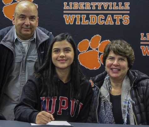 Emma Manolovic, who committed to Indiana University-Purdue University Indianapolis for soccer, poses with her parents. 