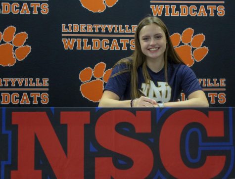 Emma Gleason signs her commitment to University of Notre Dame for swimming. 