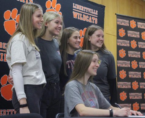 Kristine Kropp, who committed to the University of Detroit Mercy for lacrosse, smiles alongside her friends. 