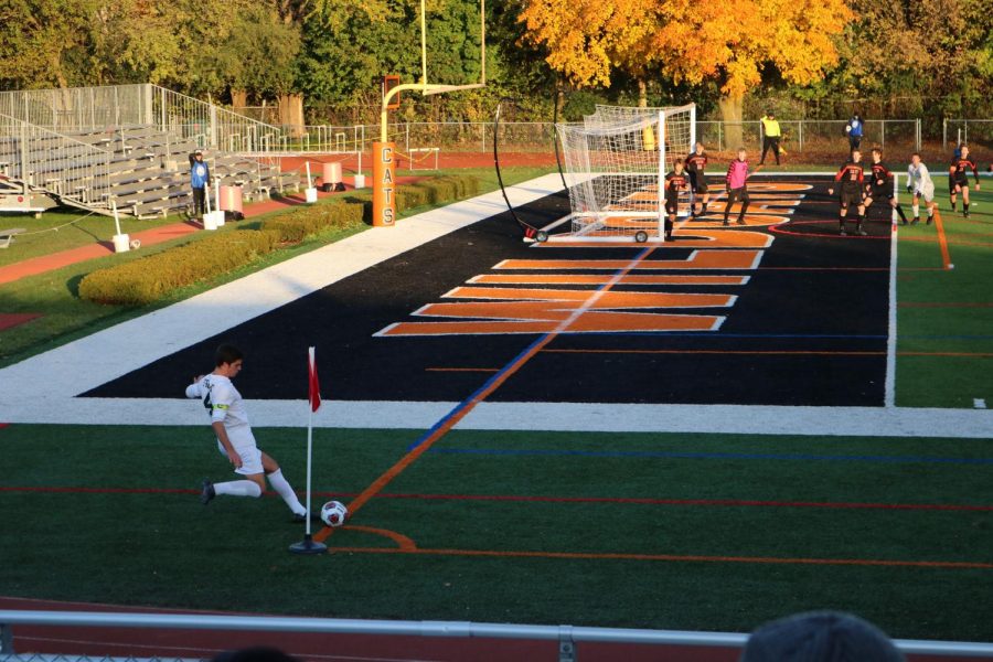 Fremd’s team captain shoots a corner kick towards the Libertyville goal while goalie Michael Krukonis (in pink) awaits to try to intercept the ball.