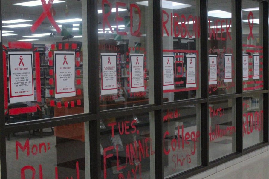 The+Friday+before+Red+Ribbon+Week+started%2C+students+decorated+the+library+and+cafeteria+windows+with+red+paint+and+informational+posters+to+spread+awareness.