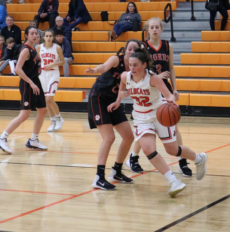 Buchert charges towards the basket, attempting to score.