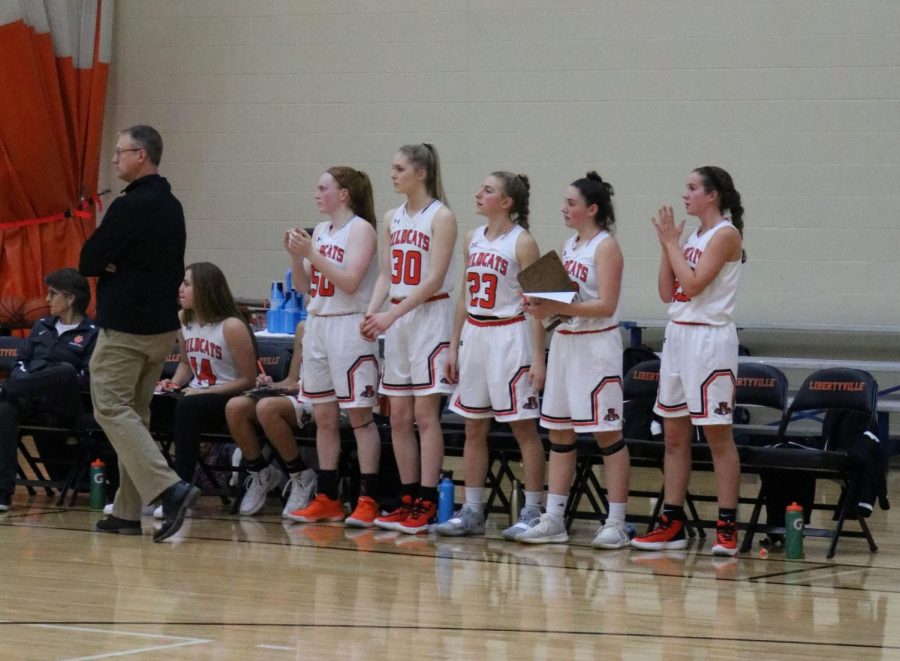 The Wildcats cheer on their team after Huber gets a rebound.