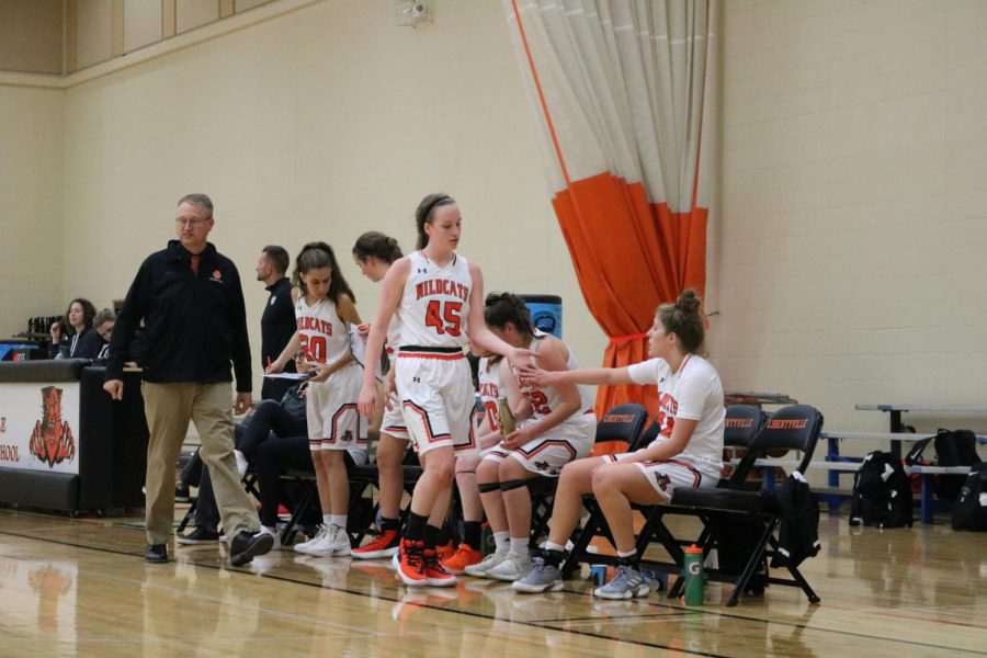 Teammates congratulate Frea after she’s pulled out from the game.