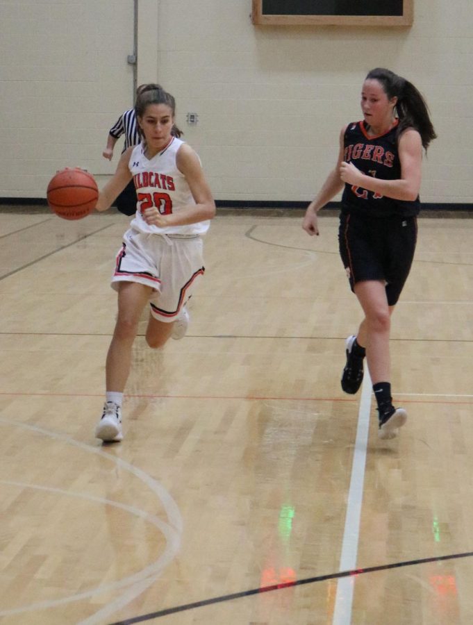 Junior Elise Rodriquez sprints to the offensive side of the court after the Wildcats get a rebound.