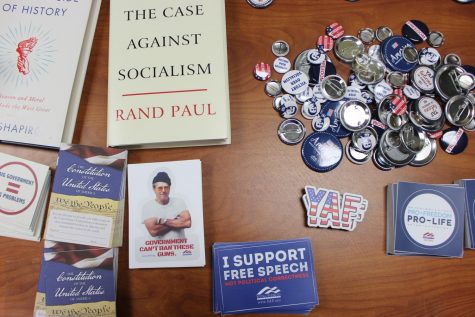 Students who attended the club’s first meeting signed in on a table with brochures, books and stickers that align with the club’s beliefs.