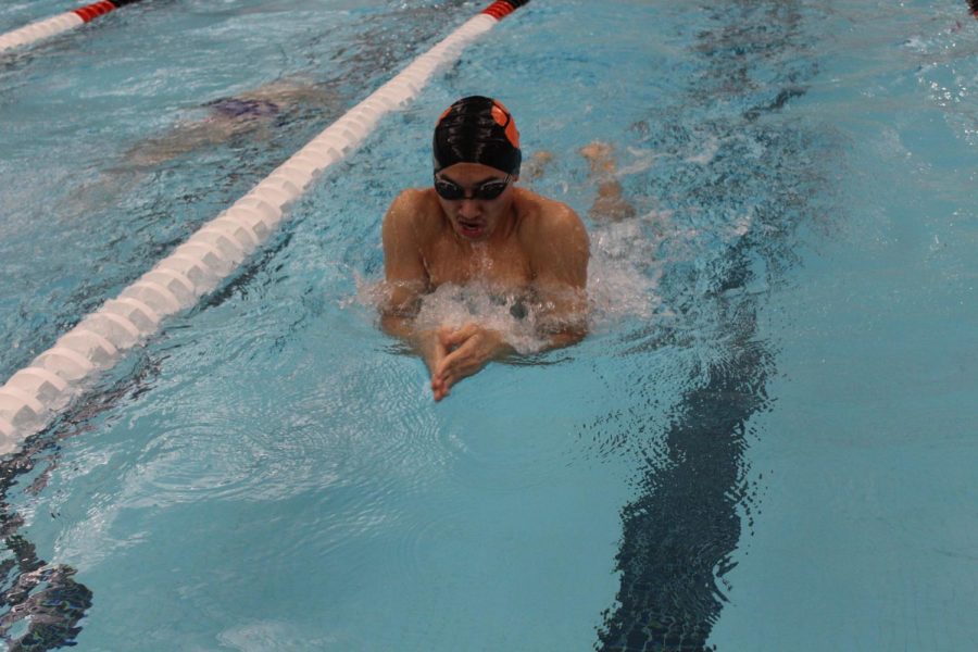 Senior Andrew Yan propels himself forward with a powerful breaststroke.