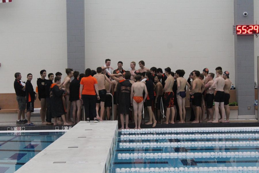 The team captains give the team a pep talk before starting their cheer.