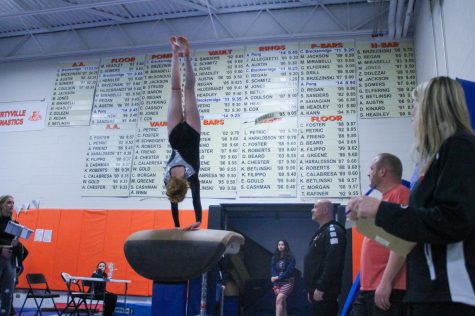 Senior Constance Zanze completes a half-on-half-off during her performance on the vault. 