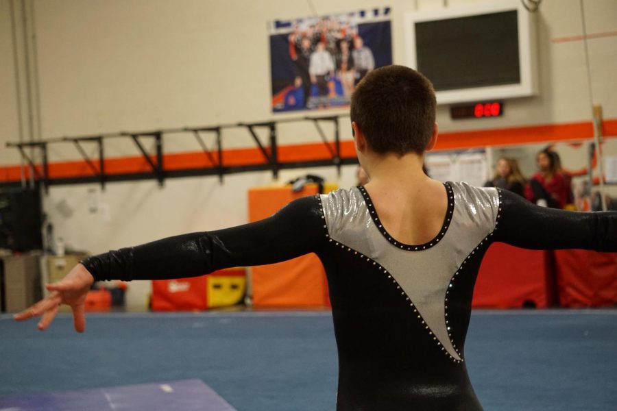 Bertaud prepares to do a front-tuck-front-tuck in her floor routine.