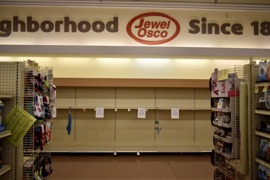 Shelves that usually contain toilet paper, paper towels and other toiletries were empty at the Libertyville Jewel-Osco on Sunday, March 15.