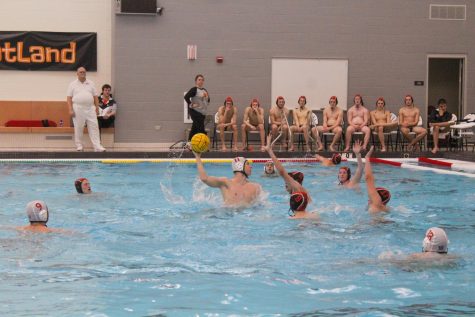 Libertyville players defend their goal against a Deerfield player’s attempt at a shot, blocking him from scoring.