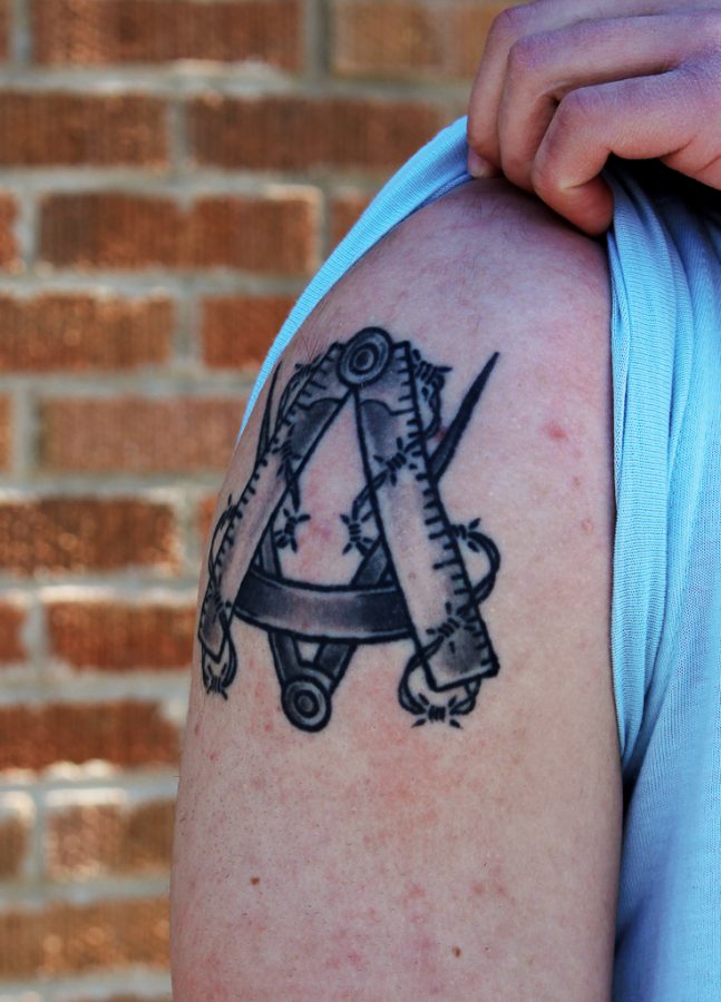 Senior Christian Voelker has a tattoo of the bricklayers union symbol on his right shoulder as a tribute to his grandfather, who was a bricklayer.