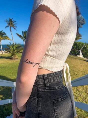 Photo courtesy of Lizzie Behnke. Senior Lizzie Behnke’s mom passed away four years ago. Behnke has “I Love You” tattooed above her elbow in memory of her.