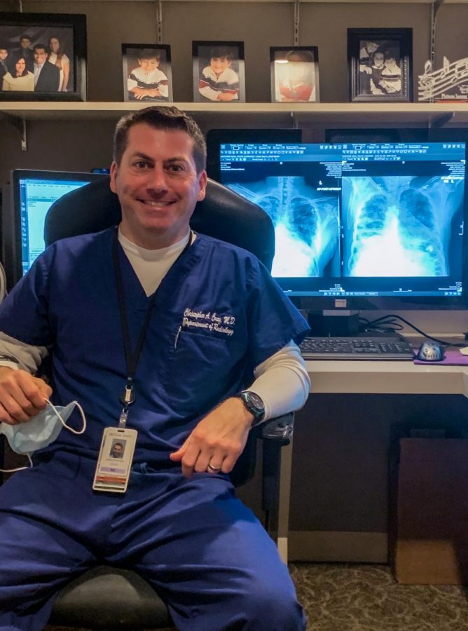 Photo courtesy of Dr. Chris Coury
Dr. Chris Coury is a Radiologist at Condell Hospital and has recently scanned several COVID-19 patients. Pictured behind him are COVID-19 pneumonia x-rays. 
