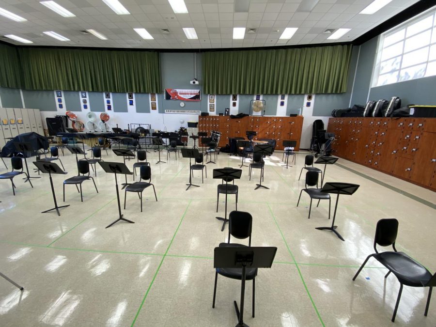 The band room is set up using social distancing precautions, marked by green tape on the floor, to make playing instruments in school safe.