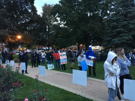 Supporters at the rally gathered in Cook Memorial Park with signs and posters. 